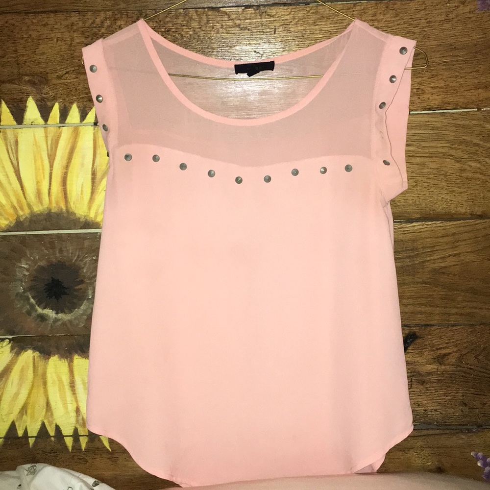 Cute pink flowy top with accent studs!